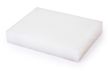 White new polyurethane board for die-cutting isolated on a white background with clipping path. Slab is used as support for the material being cut by mechanical pressing of the die. Craftsmen tools. 