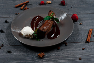 brownie dessert on grey served table. traditional dish menu served in a restaurant