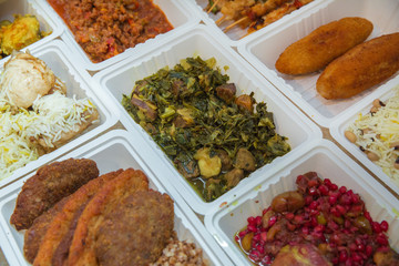 Delivery sets of healthy and delicious food in boxes . A variety of fast food in plastic boxes .