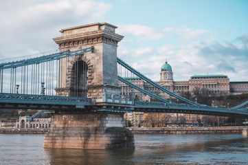 Chain bridge on the Danube river in Budapest, in the background the Buda castle