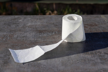 wooden background in retro style on it lined with pyrimide toilet paper