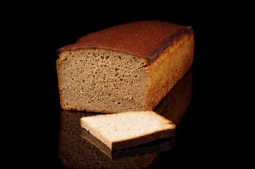 Loaf of dark rye bread isolated