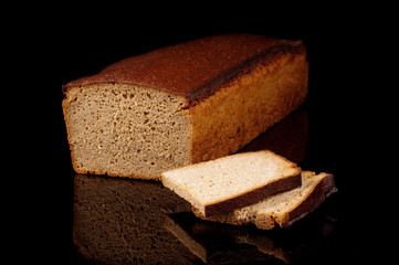 Loaf of dark rye bread isolated
