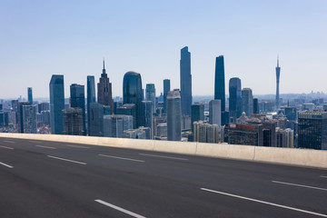 Fototapeta na wymiar Expressway with urban scenery background in Guangzhou