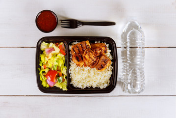 Healthy food delivery or take away lunch in tray.