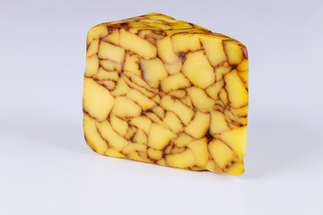 Piece of cheddar Irish porter cheese.