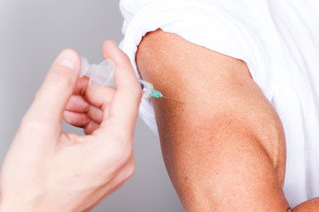 Person gets a vaccine in times of coronavirus