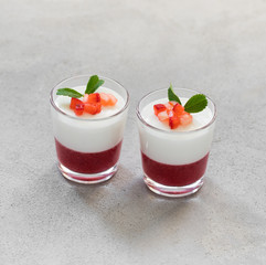 Creamy berry dessert Panna cotta vanilla with strawberries in a glass on a light background