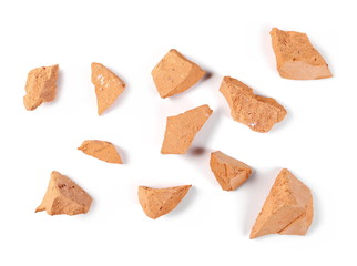 Shattered brick chunks isolated on white background, top view