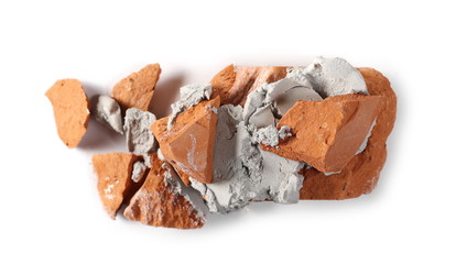 Shattered brick with wet cement, mortar isolated on white background, top view