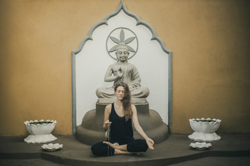 the woman meditating by mudra-youga