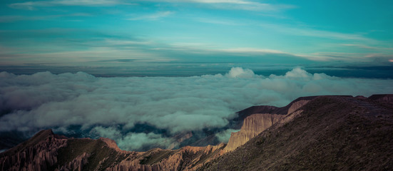 beautiful sunrise touching the sky above the clouds