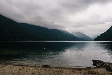 Beautiful Chilliwack lake green forest and cloudy sky british columbia canada.
