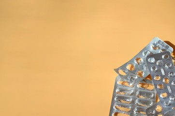 Pack of empty blisters from pills on a background with free space for text