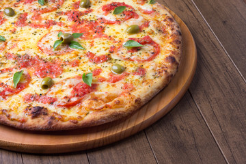 Pizza Marguerita made with tasty pizza dough, Mozzarella, tomatoes, marjoram and green olives....