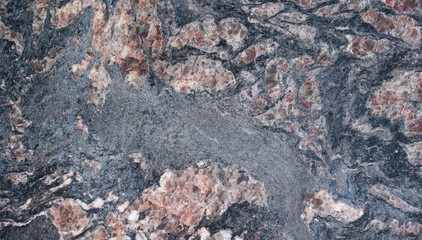 dark gray and red marbled natural stone background with abstract pattern