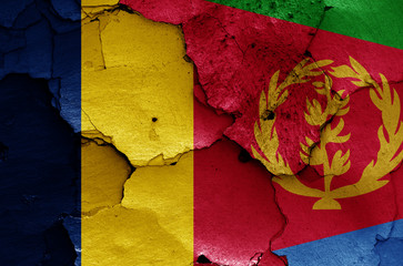 flags of Chad and Eritrea painted on cracked wall