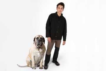 Attractive Young Male Model and English Mastiff Dog in Studio Against a White Backdrop