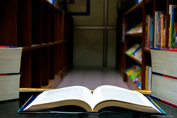 The open book was placed on a table in the library