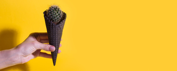 Contemporary art collage. Concept Cactus ice cream on bright yellow background. Minimal summer...