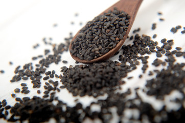 black cumin, habatussauda, in a wooden spoon