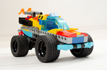 toy truck , made from brick, block on a white background