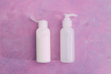 skincare and beauty,  group of moisturizers bottles and toner lotionson pink background