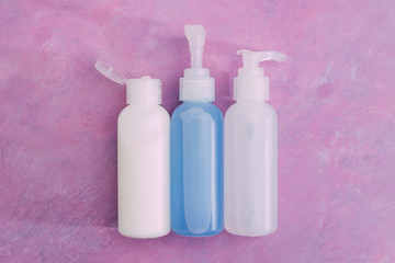 skincare and beauty,  group of moisturizers bottles and toner lotionson pink background