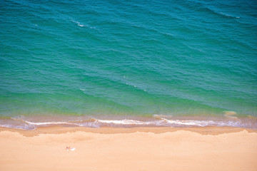 Aerial view of a sandy beach with blue sea water in the resort town of Nha Trang Vietnam