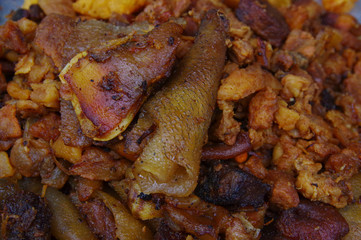 Close up of hornado roasted pork with a corn, ecuadorian traditional typical andean food over a tray