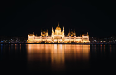 Fototapeta na wymiar Hungarian Parliament Building and Danube river at night, Budapest, Hungary