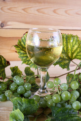 Grape and wine on table