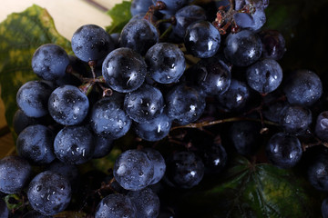 Black wine grape on table
