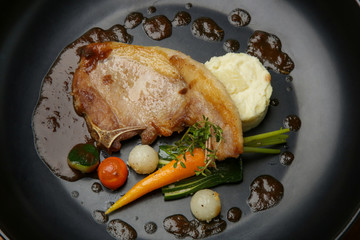 Pork chop with vegetables. Exquisite dish, creative restaurant meal concept, haute couture food.