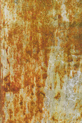 Multicolored background: rusty metal surface with flaking and cracking texture.