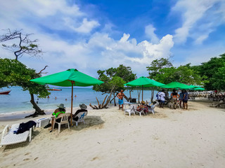 BARU, CARTAGENA, COLOMBIA - NOVEMBER 09, 2019: View on paradise beach with tourists of Playa Blanca on Island Baru by Cartagena in Colombia.