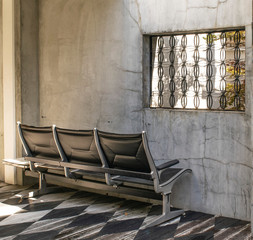 Set of modern seats facing a wall
