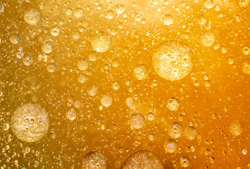 golden yellow bubble oil droplet, abstract background