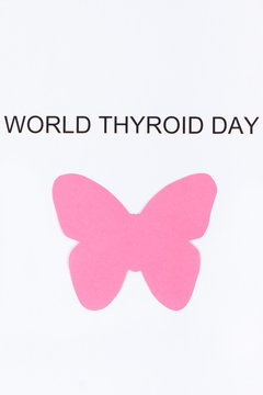 Pink thyroid shape and inscription World Thyroid Day. Problems with thyroid