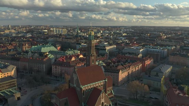 Circle pan aerial view of &Ouml;stermalm in Stockholm City during sunset.