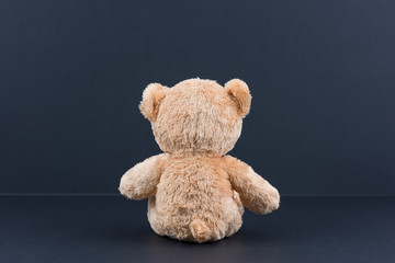 Teddy bear and black background