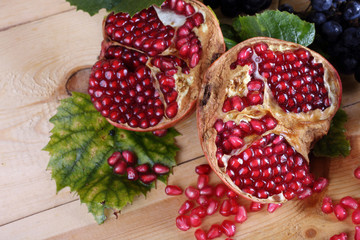 Pomegranate and grape on table