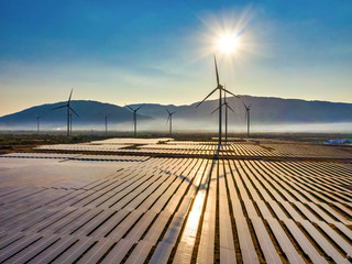 Aerial view of windmill and Solar panel, photovoltaic, alternative electricity source - concept of sustainable resources on a sunny day, Bac Phong, Thuan Bac, Ninh Thuan, Vietnam