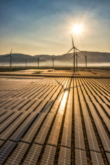Aerial view of windmill and Solar panel, photovoltaic, alternative electricity source - concept of sustainable resources on a sunny day, Bac Phong, Thuan Bac, Ninh Thuan, Vietnam © Hien Phung