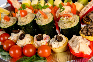 plate with meat, meatballs, vegetables, cheese, mushrooms and bread