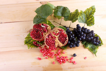 Pomegranate and grape on table