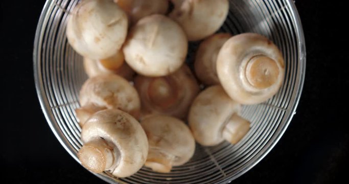 Fresh fragrant mushrooms in a colander.
