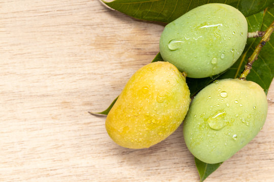 Wild mango on wooden background