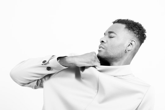 Upset Man Pulling Jacket Against White Background