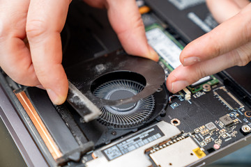 install the fan after cleaning the dust on laptop